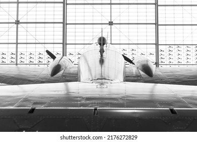 A B-25 Mitchell WW2 Airplane From The Rear, Facing Closed Hanger Doors