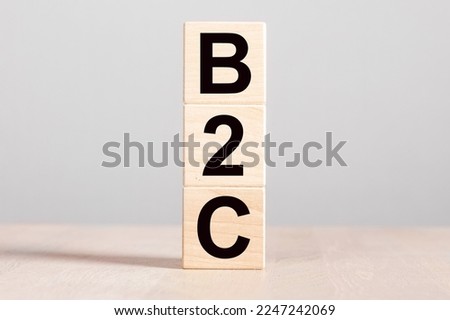 B2C acronym, business to customer client concept. Wood blocks on desk. . High quality photo