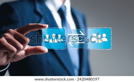 B2C, Business to customer marketing strategy concept. Businessman holding virtual B2C icon for business strategy, communication, feedback, online marketing. E-commerce marketing strategy.