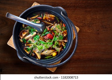 Ba Ku Teh, Malaysian Herbal Cuisine of Pork Soup. Delicious and Healthy Cuisine Gourmet on the Wood Table. Cliping Path Added.