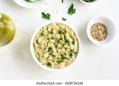 Baba Ganoush (roasted Eggplant Dip) In Bowl Over Light Stone Background. Vegetarian Vegan Food Concept. Top View, Flat Lay