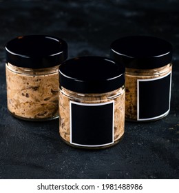 Babaganush or eggplant caviar from baked eggplant, babaganush in a jar on a dark background, eggplant babaganush (eggplant puree)
