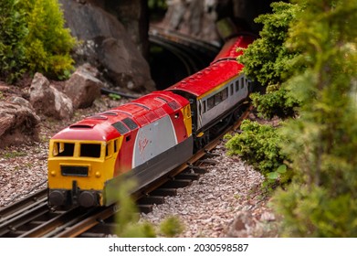 BABBACOMBE, TORQUAY, ENGLAND- 26 June 2021: Model Virgin Train At Babbacombe Model Village In Torquay