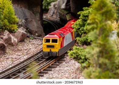 BABBACOMBE, TORQUAY, ENGLAND- 26 June 2021: Model Virgin Train At Babbacombe Model Village In Torquay