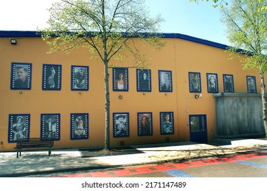                 Babelsberg Potsdam Germany - April 29 2022 Movie Studio Yellow Building With Pictures Of Famous Actors                