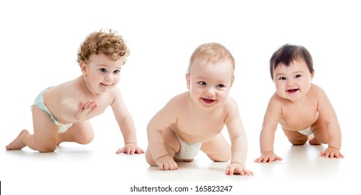 Babies group wearing diapers. Kids are crawling on floor.