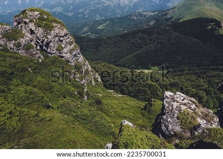 Babin Zub mountain peak in Old Mountain National park, nature preserve between Serbia and Bulgaria. Stara Planina beautiful landscape with mountains and rocks on a sunny summer day.