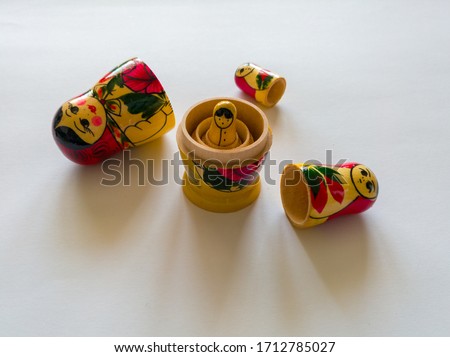 Babushka or Matryoshka is a Russian wooden toy consisting of folding dolls and inside which are smaller dolls.