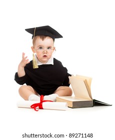 Baby in academician clothes  with roll and book