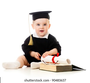 Baby in academician clothes  with roll and book
