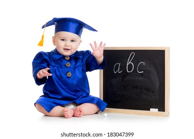 Baby in academician clothes  sitting at chalkboard