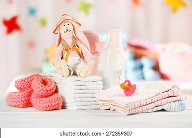 Baby accessories on table on light background - Powered by Shutterstock