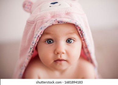 Baby After Bathing. Baby Girl Is In Pink  Teddy Bear Towel.