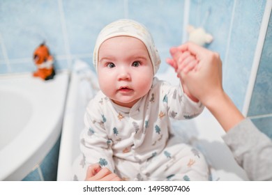 Baby After Bathing. Little 8 Months Old Baby After Bathing On Changing Mat.