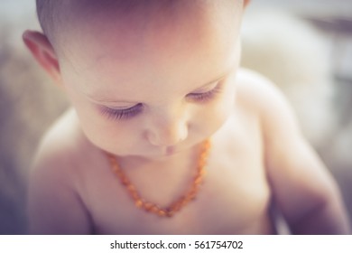 Baby With Amber Teething Necklace Front View