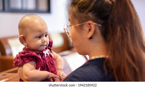 Baby Asian Girl Reaches For Adults Face Grasping For Anything Sh