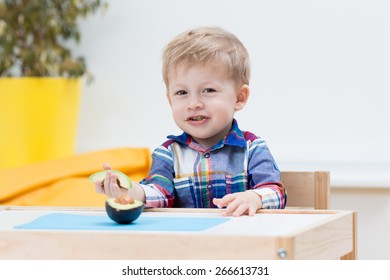 Baby With Avocado.