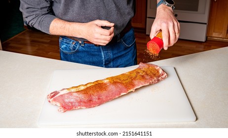 Baby Back Ribs Are Sprinkled With Spiced Rub For Smoking