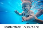 Baby background. Happy infant learn to swim, dive underwater with fun in pool to keep fit. Diving.