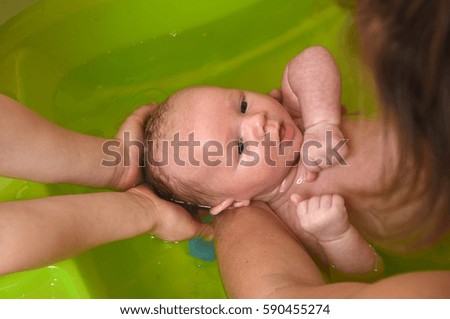 Similar – Newborn in the bathtub