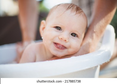 Baby Bathing In The Garden