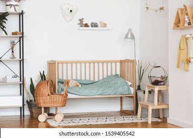 Baby Bedroom Interior with Cozy Wooden Bed, Wicker Stroller and Rack In Scandinavian Style
