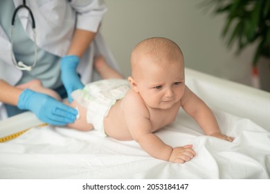 Baby Being Prepared For A Thigh Injection