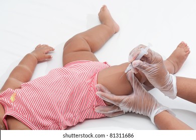 Baby Being Vaccinated By Nurse With Latex Free Gloves