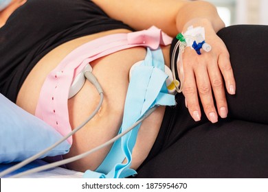 A baby belly and an applied CTG before childbirth 