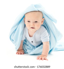A Baby With A Blue Blanket Wrapped Around And Over The Head.