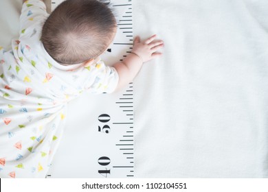 Baby Body And Measuring Tape: Concept Of Baby Growth, Height, Development