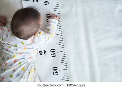 Baby Body And Measuring Tape: Concept Of Baby Growth, Height, Development