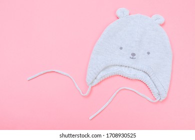 Baby Bonnet On Pastel Pink Background - Image 