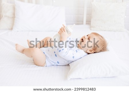 Similar – Image, Stock Photo Blonde boy does a roll under blue water in swimming pool