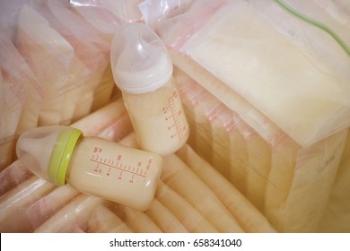 Baby Bottle With Milk And Frozen Breastmilk In Storage Bags In Freezers, Vintage Style