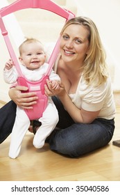 Baby In Bouncer With Mother