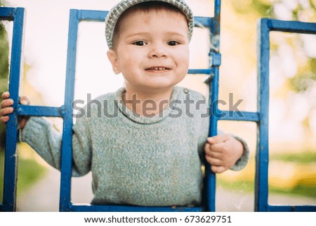 Similar – Image, Stock Photo Little cute boy looking at camera and sticking out his tongue