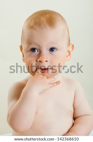 Similar – Happy adorable infant baby boy child smiling while eating two frozen fruit popsicle ice creams in simmer.