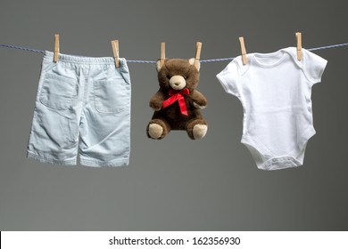 Baby Boy Clothes, A Teddy Bear On The Clothesline