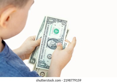 Baby Boy Counting Some Dollar Bills Isolated On White Light Background.top View Over Shoulder From Back.money Saving Financial Education Kids Family.one Two Dollars Banknote In Child Hands Isolated 