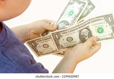 Baby Boy Counting Some Dollar Bills Isolated On White Light Background.top View Over Shoulder From Back.money Saving Financial Education Kids Family.one Two Dollars Banknote In Child Hands Isolated 