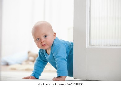 Baby Boy Crawling Around Door