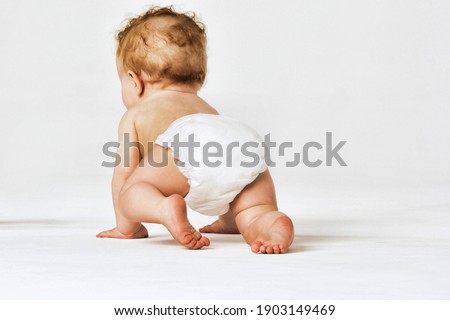 Baby boy crawling isolated on white background