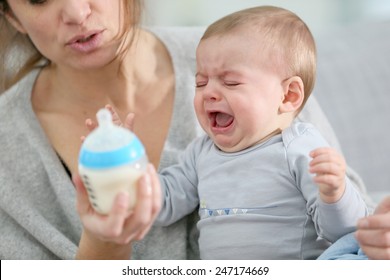Baby boy crying to have food - Shutterstock ID 247174669