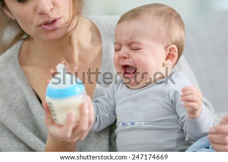 Baby boy crying to have food