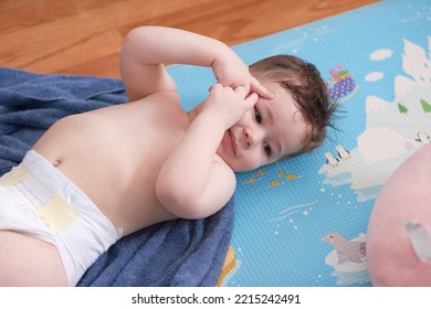 Baby Boy In Diapers After A Bath And Getting Dressed