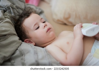 Baby Boy In Diapers After A Bath And Getting Dressed