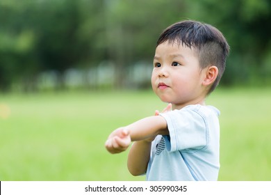 Baby Boy Feeling Itchy And Scratching His Arm