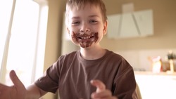 Baby Boy And Girl Eat Chocolate. Dirty Little Baby Kids In Lifestyle The Kitchen Eating Chocolate In The Morning. Happy Family Eating Sweets Kid Dream Concept. Baby Dirty Face Eating Chocolate Cocoa