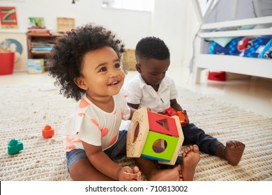 Baby Boy And Girl Playing With Toys In Playroom Together - Shutterstock ID 710813002
